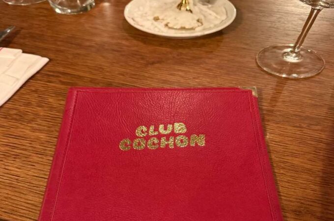 Red menu with golden letters Club Cochon