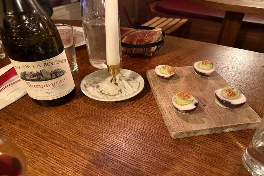 Oeufs mayo on a wooden table in Club Cochon